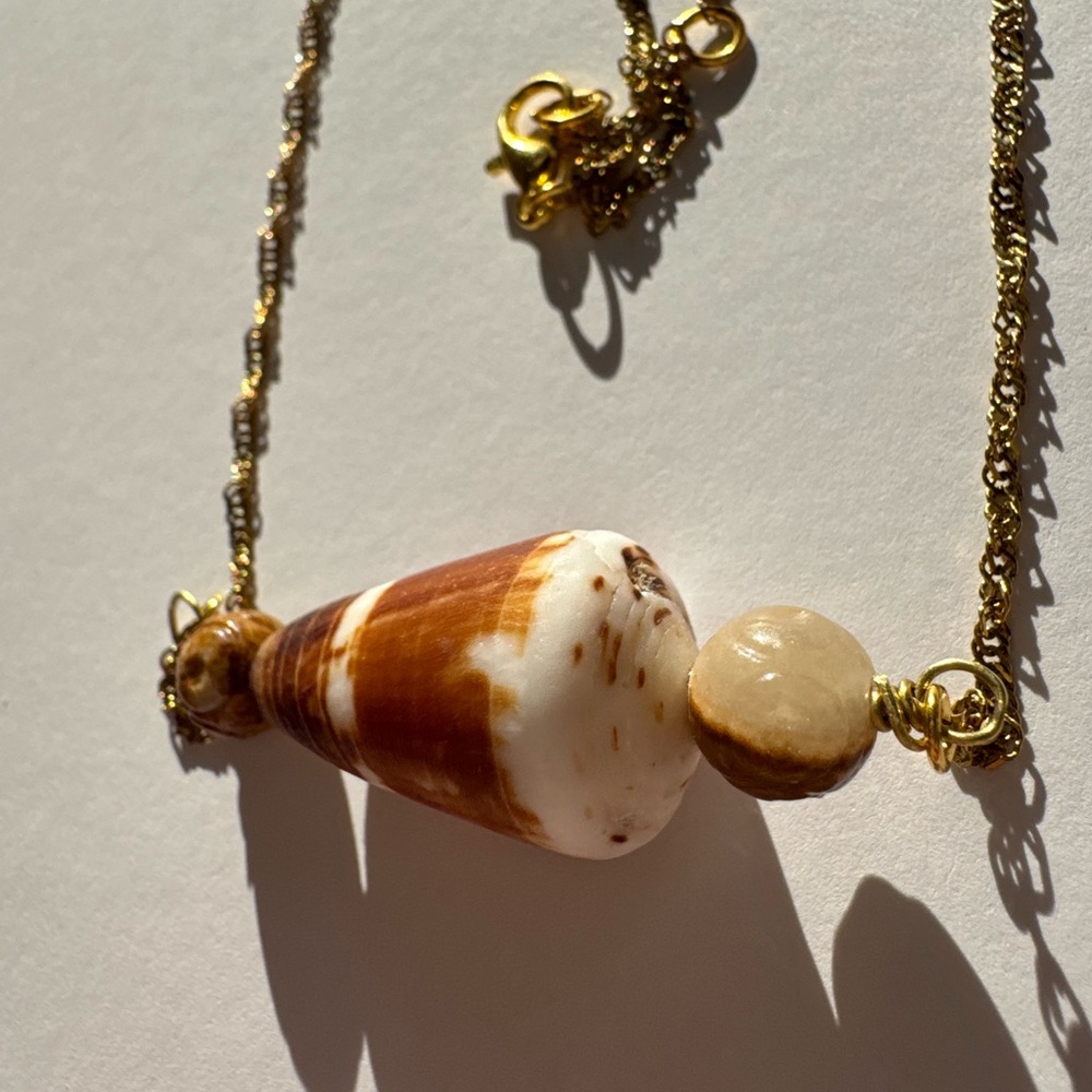 Handcrafted adjustable gold cone shell necklace with tigers eye beads